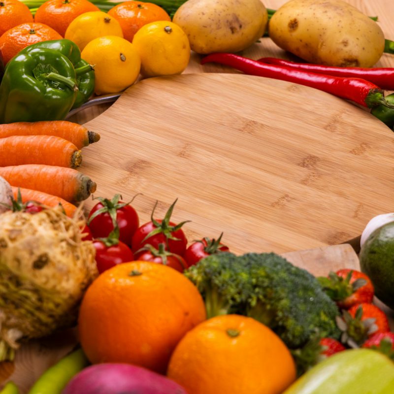 orange and green vegetables on brown wooden table
