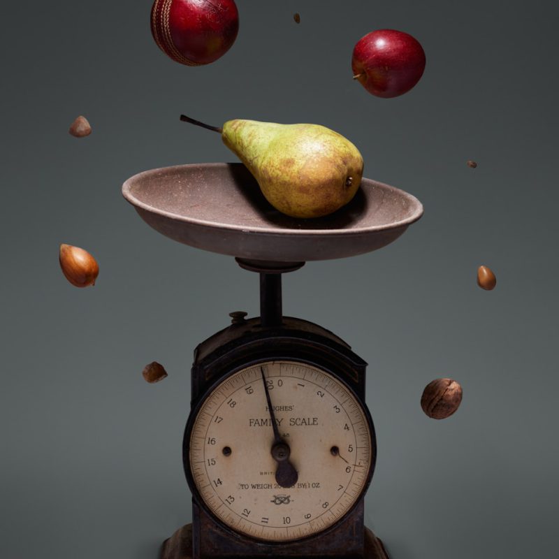 yellow and green fruit on brown weighing scale